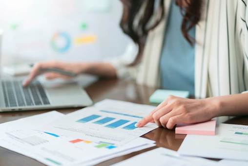 A person pointing at a graph on a paper

AI-generated content may be incorrect.